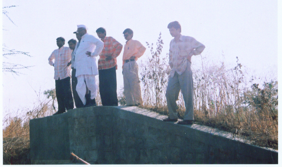 Mr.Annasaheb Hazare inspecting watershed structure constructed by AGVSS